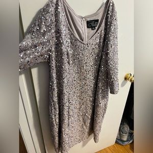 Knee length 3/4 sleeve light pink sparkly dress. Never worn out of the house.